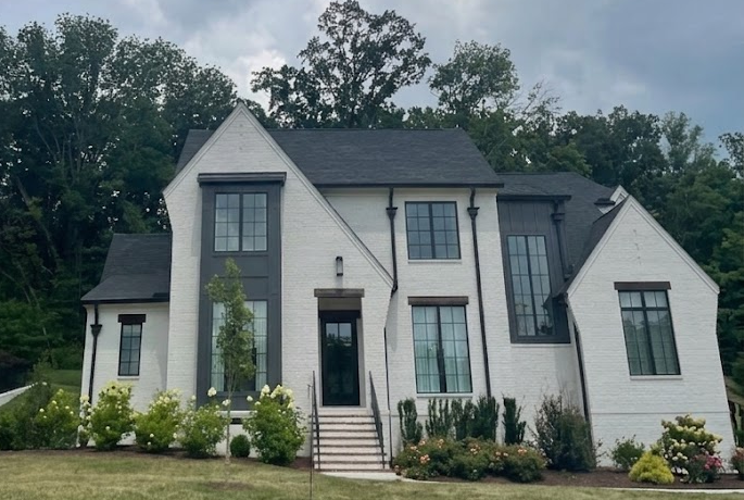 Beautifully painted white brick custom estate house exterior